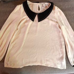 I am selling a white sheer black collar shirt, the original price is 11.99.